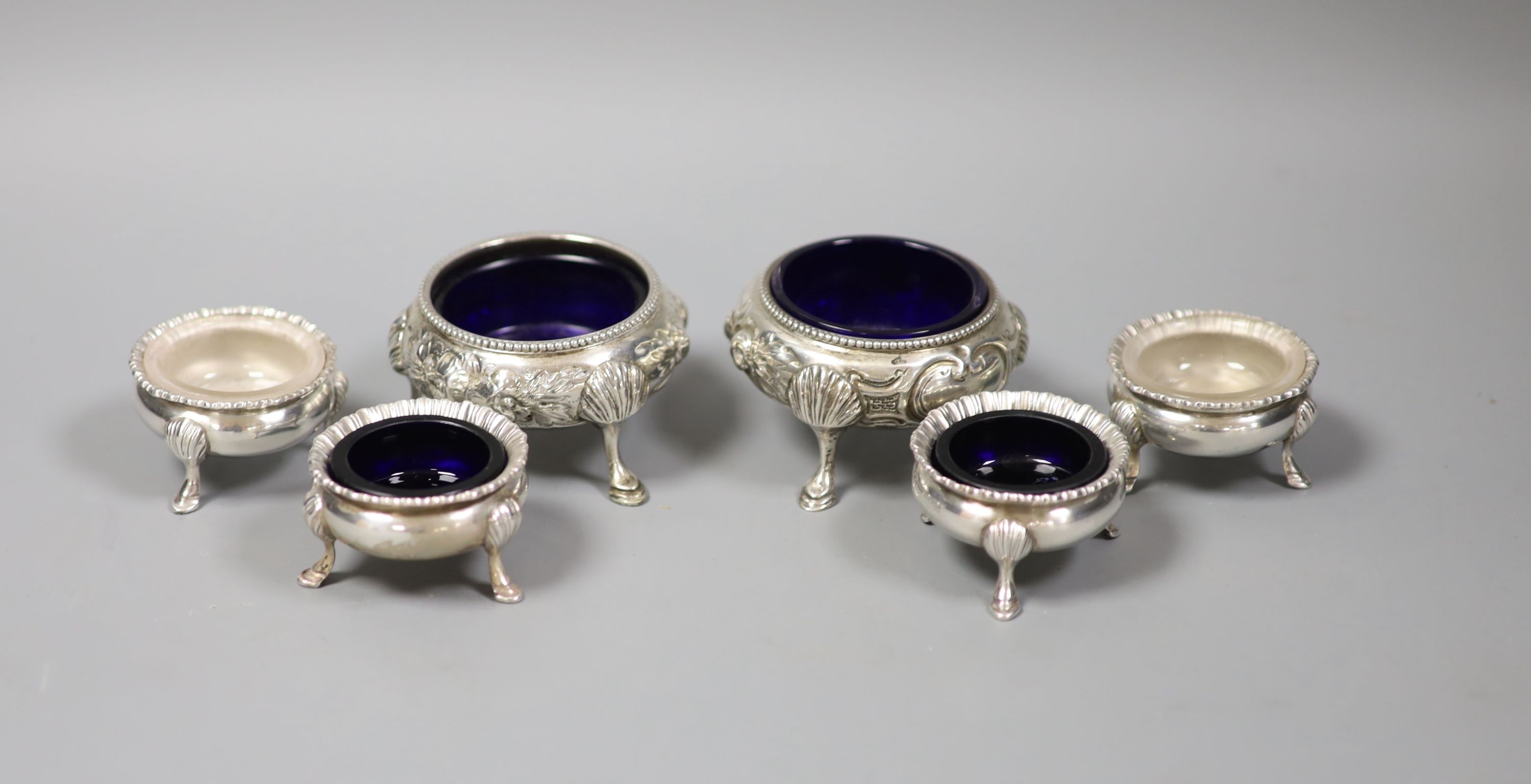 A pair of Victorian silver bun salts, London, 1862 and a set of four smaller silver salts.